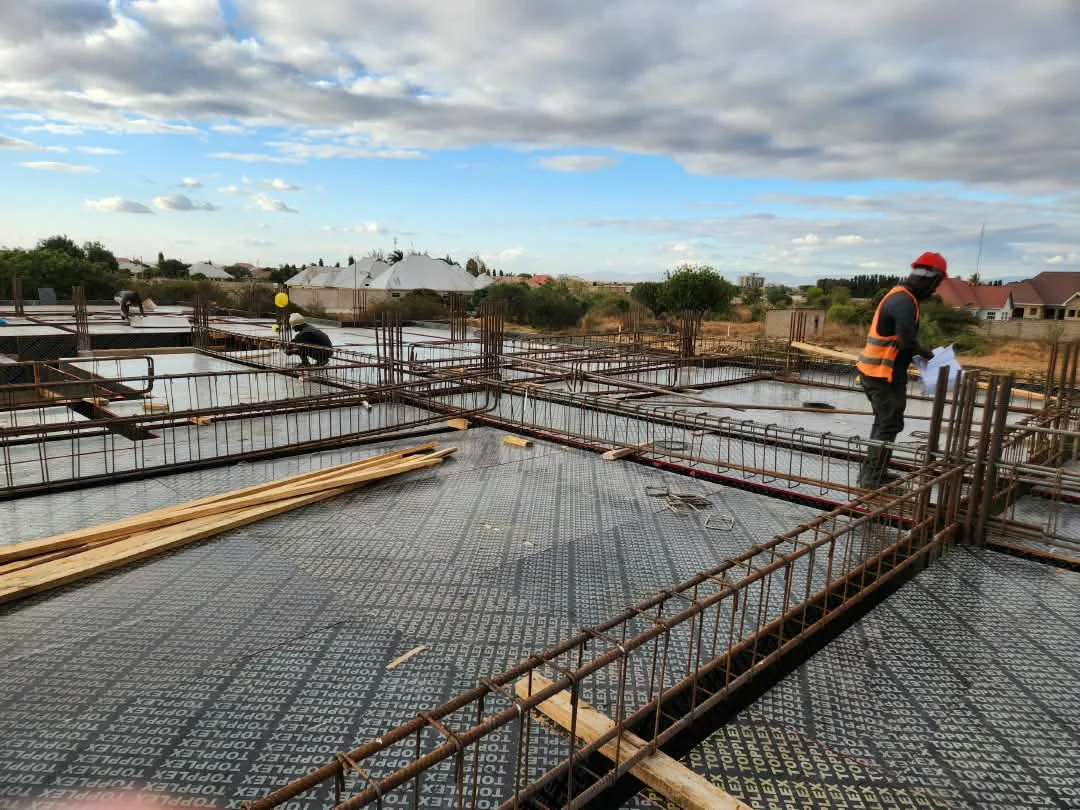 Leivant supervisor checking slab reinforcement in Dodoma